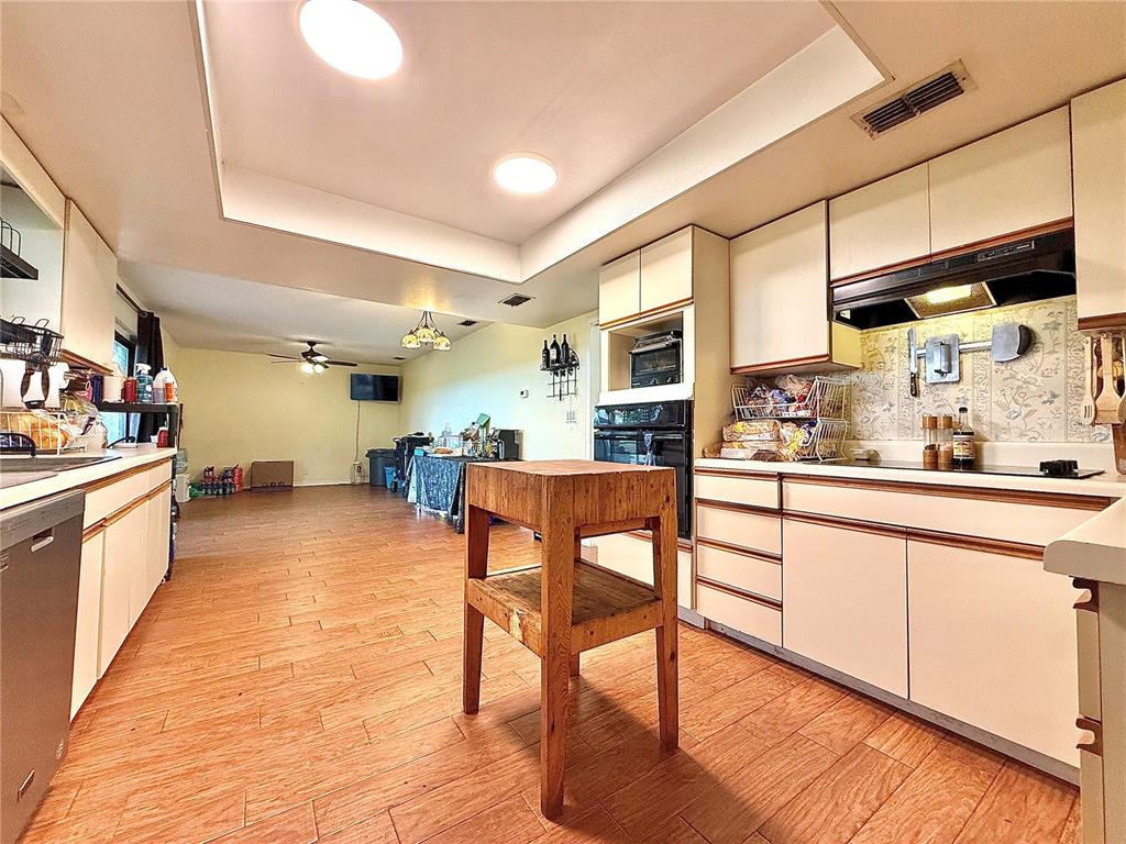 2500 Brook Road North Fort Meade, FL 33841 - Photo 17 of 65 a kitchen with stainless steel appliances granite countertop table chairs sink and cabinets