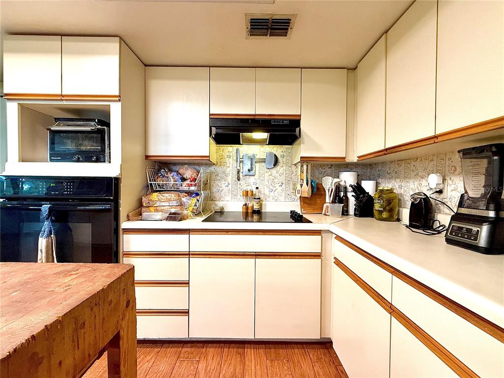 2500 Brook Road North Fort Meade, FL 33841 - Photo 19 of 65 a kitchen with granite countertop a sink stove and cabinets