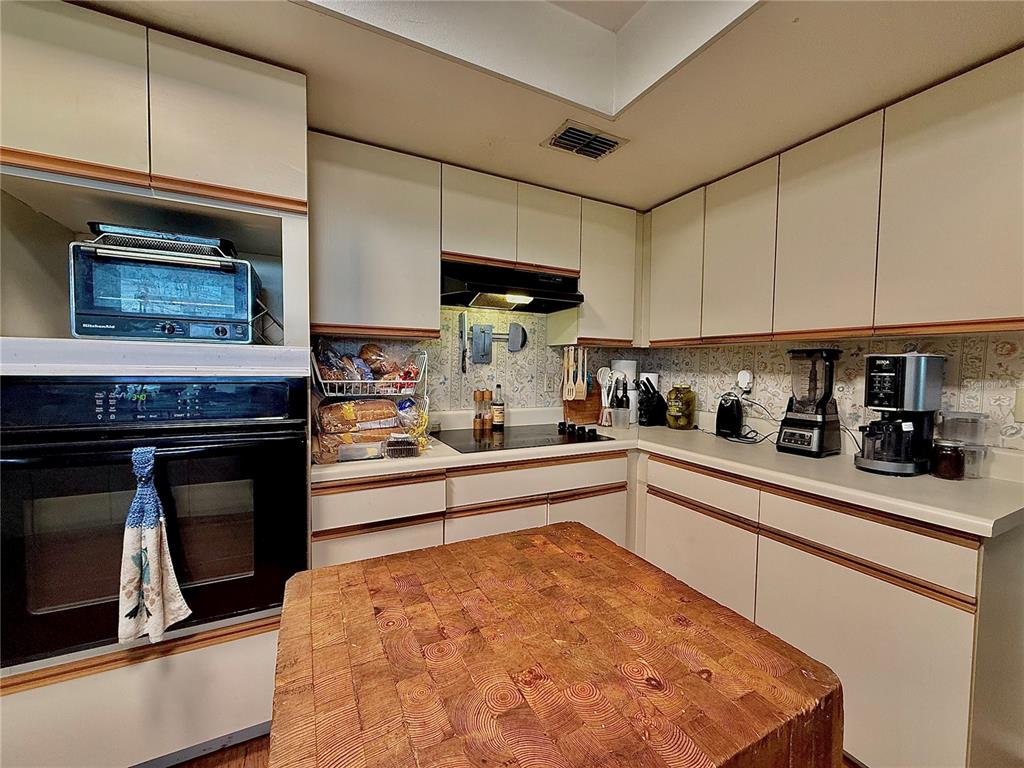 2500 Brook Road North Fort Meade, FL 33841 - Photo 20 of 65 a kitchen with stainless steel appliances granite countertop a stove and a refrigerator
