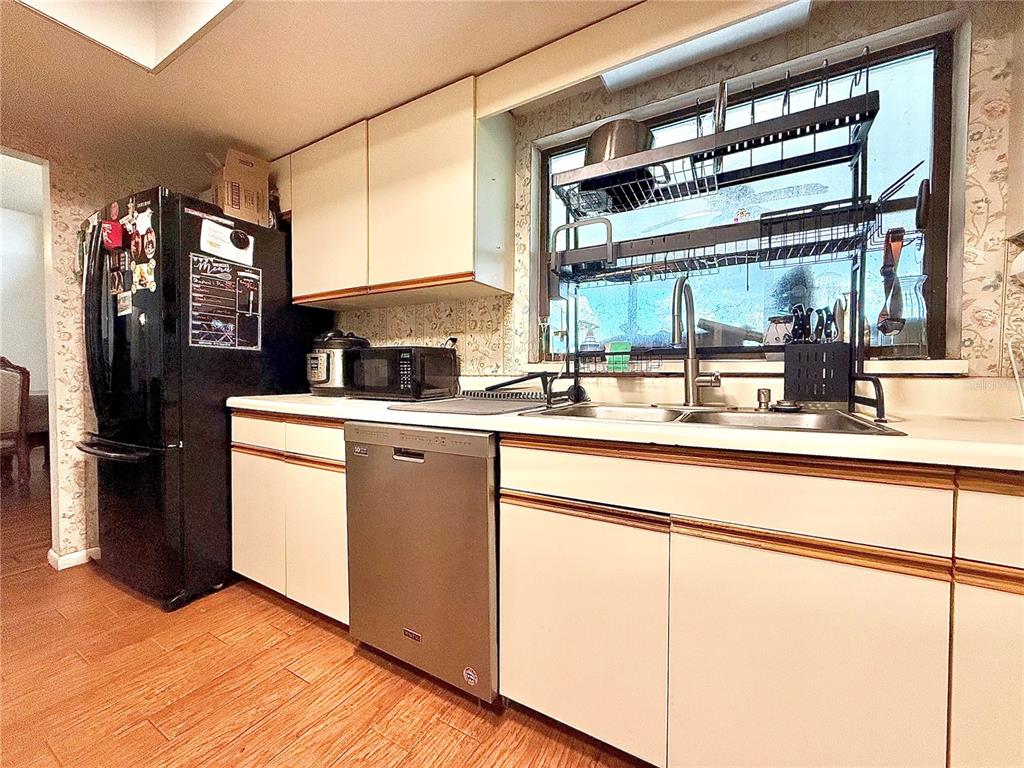 2500 Brook Road North Fort Meade, FL 33841 - Photo 22 of 65 a kitchen with stainless steel appliances granite countertop a sink and a refrigerator