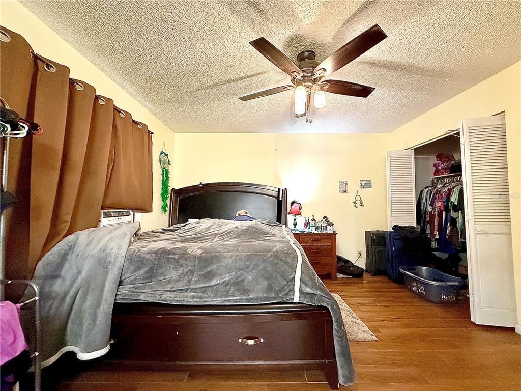 2500 Brook Road North Fort Meade, FL 33841 - Photo 26 of 65 a bedroom with a bed and wooden floor