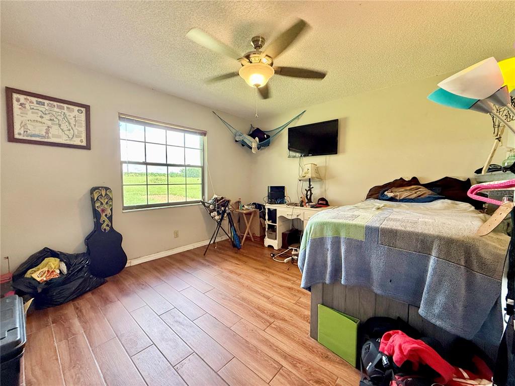 2500 Brook Road North Fort Meade, FL 33841 - Photo 38 of 65 a bedroom with furniture and a window