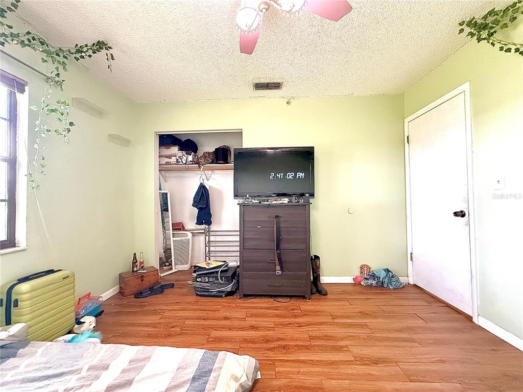 2500 Brook Road North Fort Meade, FL 33841 - Photo 44 of 65 a view of a bedroom with bed and workspace