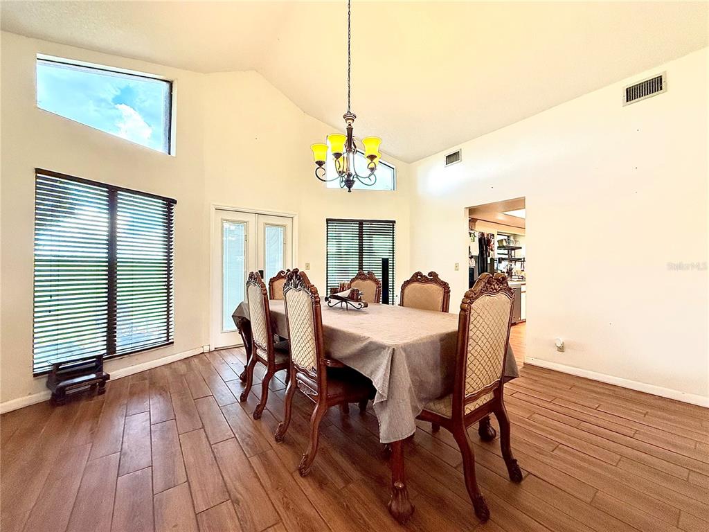 2500 Brook Road North Fort Meade, FL 33841 - Photo 46 of 65 a view of a dining room with furniture window and wooden floor