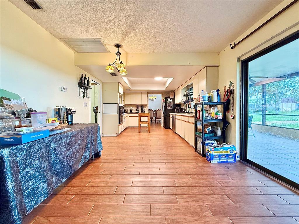 2500 Brook Road North Fort Meade, FL 33841 - Photo 49 of 65 a large space with lots of wooden furniture potted plants and a table