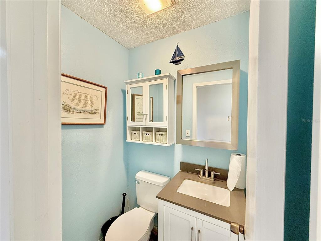 2500 Brook Road North Fort Meade, FL 33841 - Photo 50 of 65 a bathroom with a toilet sink and mirror