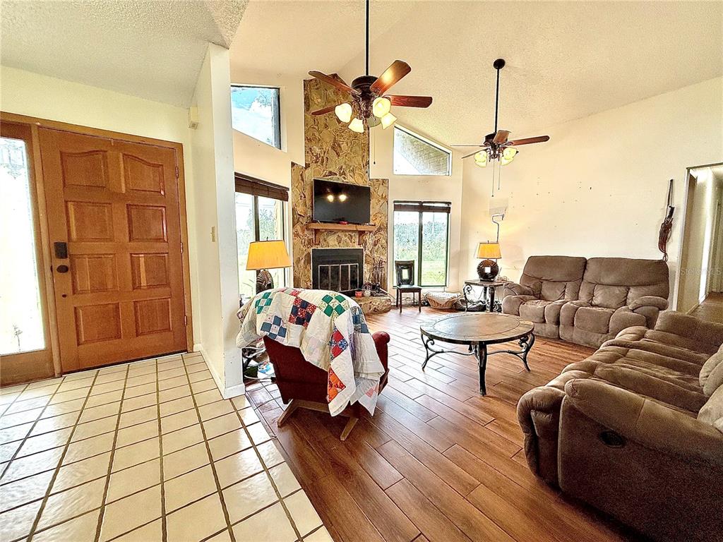 2500 Brook Road North Fort Meade, FL 33841 - Photo 5 of 65 a living room with furniture and a chandelier