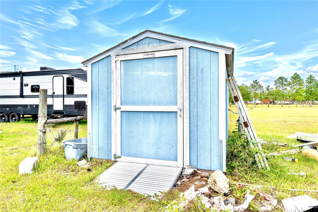 2500 Brook Road North Fort Meade, FL 33841 - Photo 57 of 65 a view of swimming pool with an outdoor seating