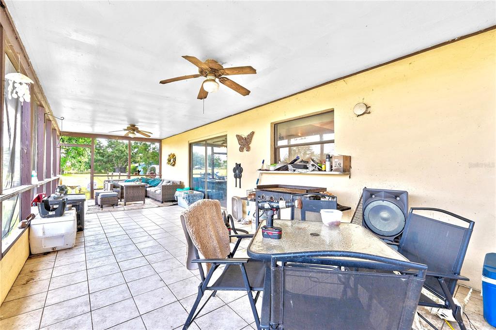 2500 Brook Road North Fort Meade, FL 33841 - Photo 58 of 65 a living room with furniture a window and a clock