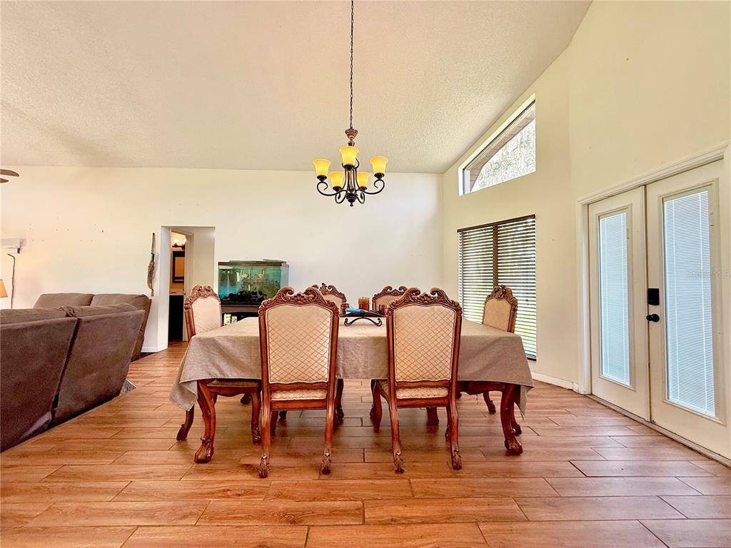 2500 Brook Road North Fort Meade, FL 33841 - Photo 10 of 65 a view of a dining room with furniture and wooden floor