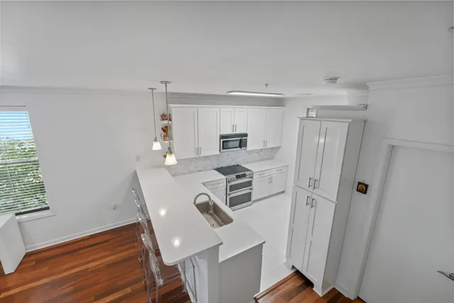 a bathroom with a sink toilet and a mirror