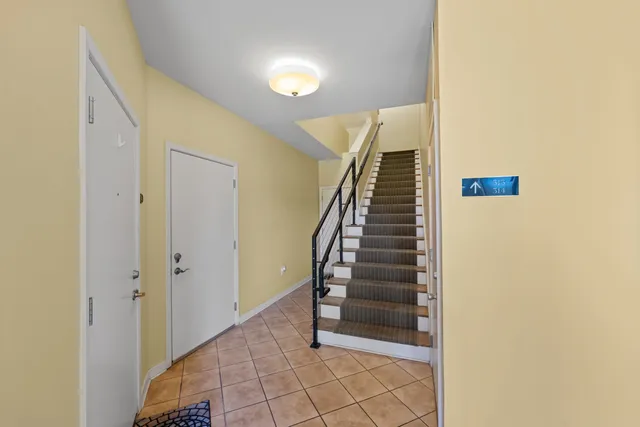 a view of an apartment with a swimming pool and a yard