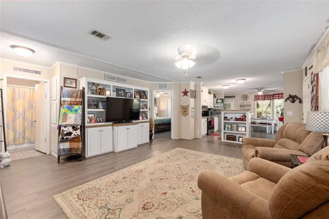 a kitchen with kitchen island granite countertop lots of counter top space and stainless steel appliances