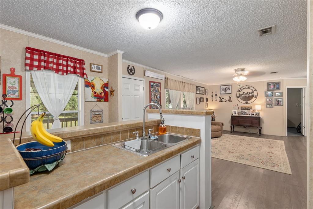760 Southwest Barney Street High Springs, FL 32643 - Photo 15 of 57 a living room with furniture and wooden floor