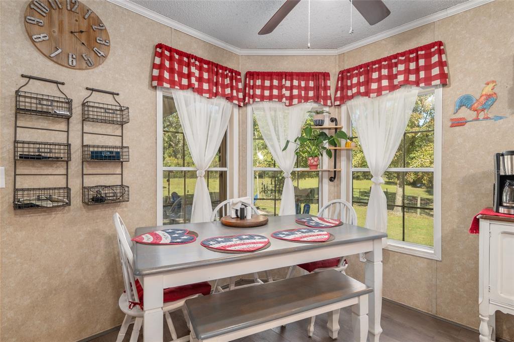 760 Southwest Barney Street High Springs, FL 32643 - Photo 18 of 57 a view of a dining room with furniture window and outside view