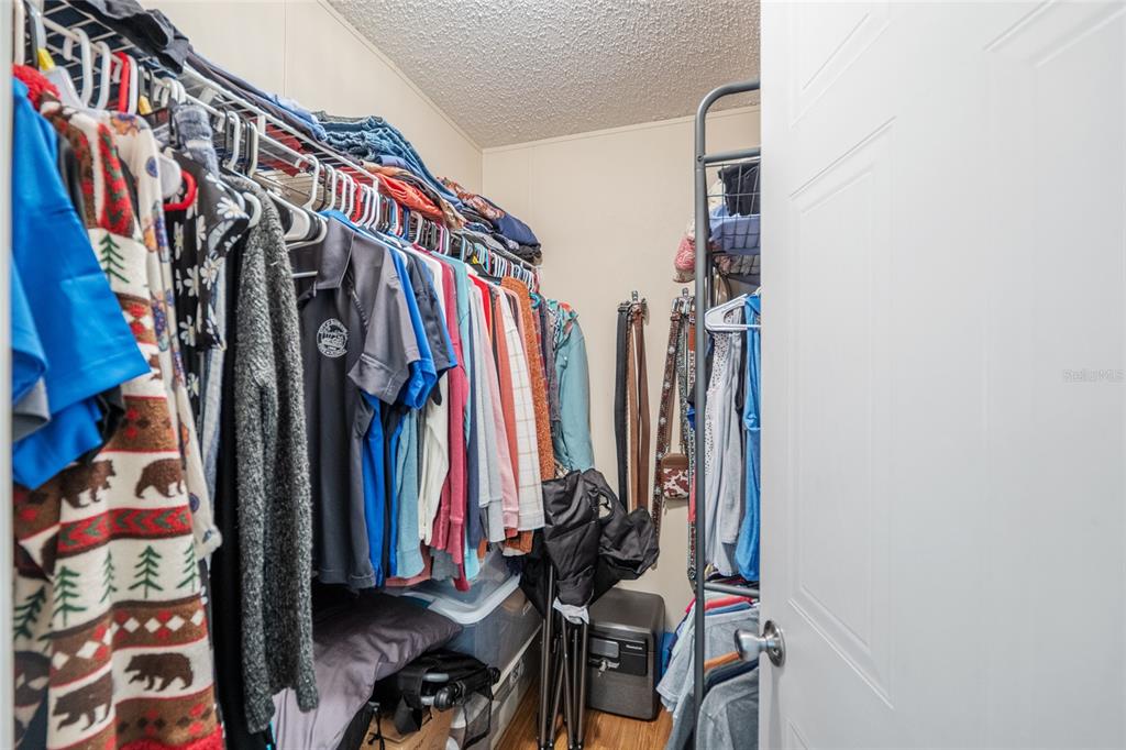 760 Southwest Barney Street High Springs, FL 32643 - Photo 26 of 57 a view of walk in closet with clothes