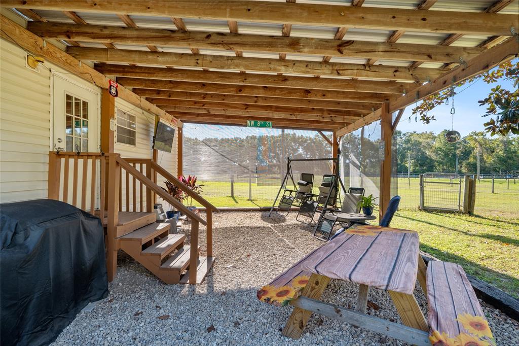 760 Southwest Barney Street High Springs, FL 32643 - Photo 31 of 57 a view of a roof deck with wooden floor