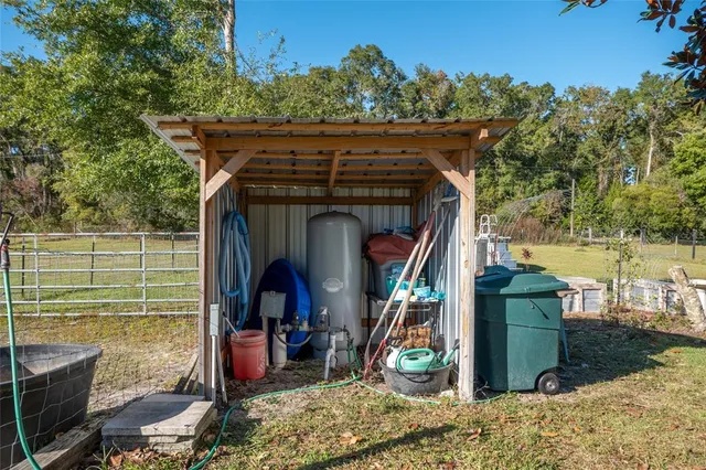 a view of a swimming pool with an outdoor seating