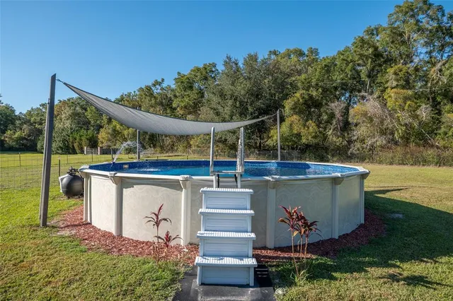 a view of a swimming pool with a lake view