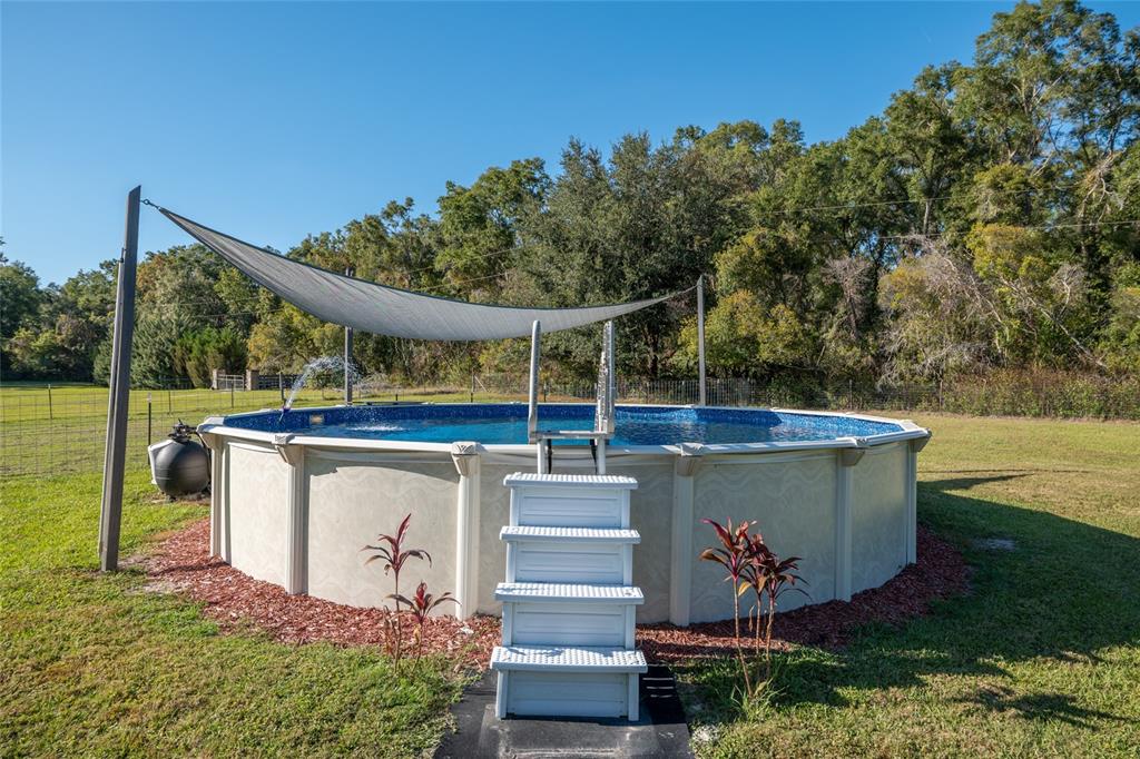760 Southwest Barney Street High Springs, FL 32643 - Photo 38 of 57 a view of a wooden deck and a yard