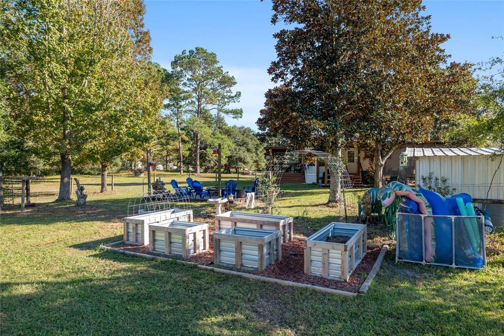 760 Southwest Barney Street High Springs, FL 32643 - Photo 39 of 57 a view of a house with pool and chairs