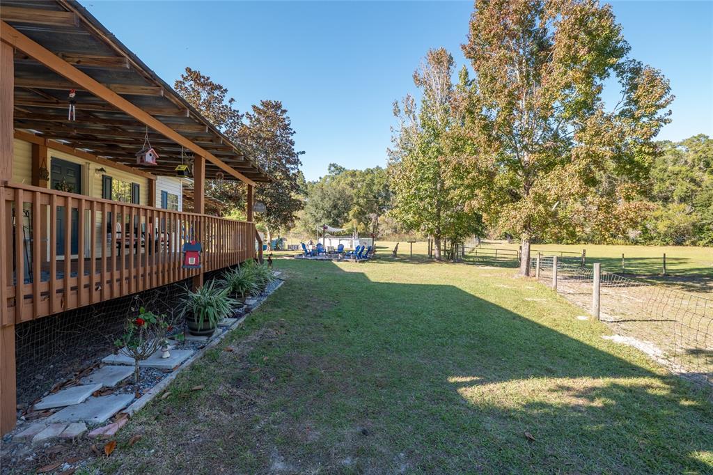 760 Southwest Barney Street High Springs, FL 32643 - Photo 4 of 57 a view of a house with backyard and sitting area
