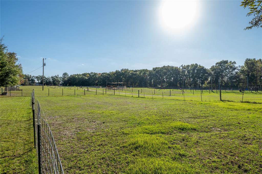 760 Southwest Barney Street High Springs, FL 32643 - Photo 42 of 57 a view of a green field