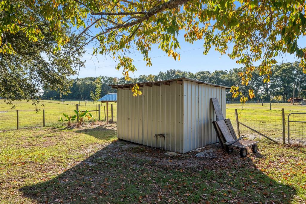 760 Southwest Barney Street High Springs, FL 32643 - Photo 43 of 57 a view of a backyard with large trees