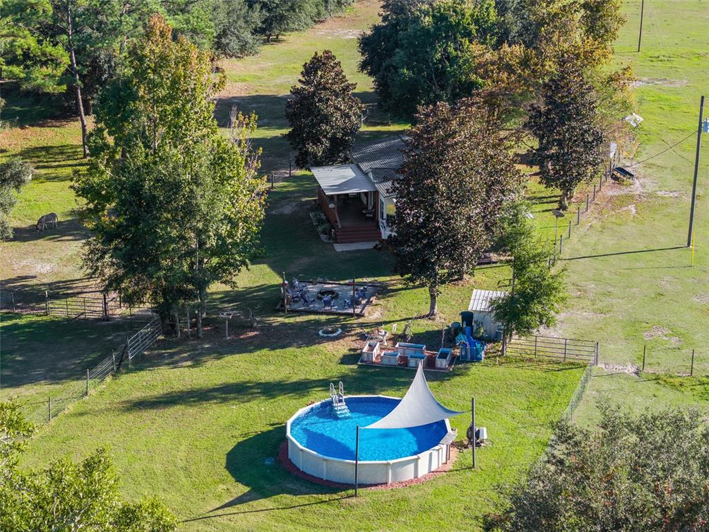 760 Southwest Barney Street High Springs, FL 32643 - Photo 48 of 57 a swimming pool with lots of tress