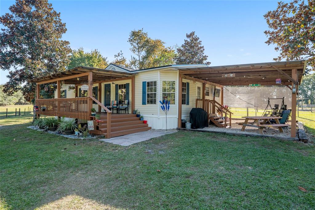 760 Southwest Barney Street High Springs, FL 32643 - Photo 5 of 57 a view of a house with a yard and sitting area