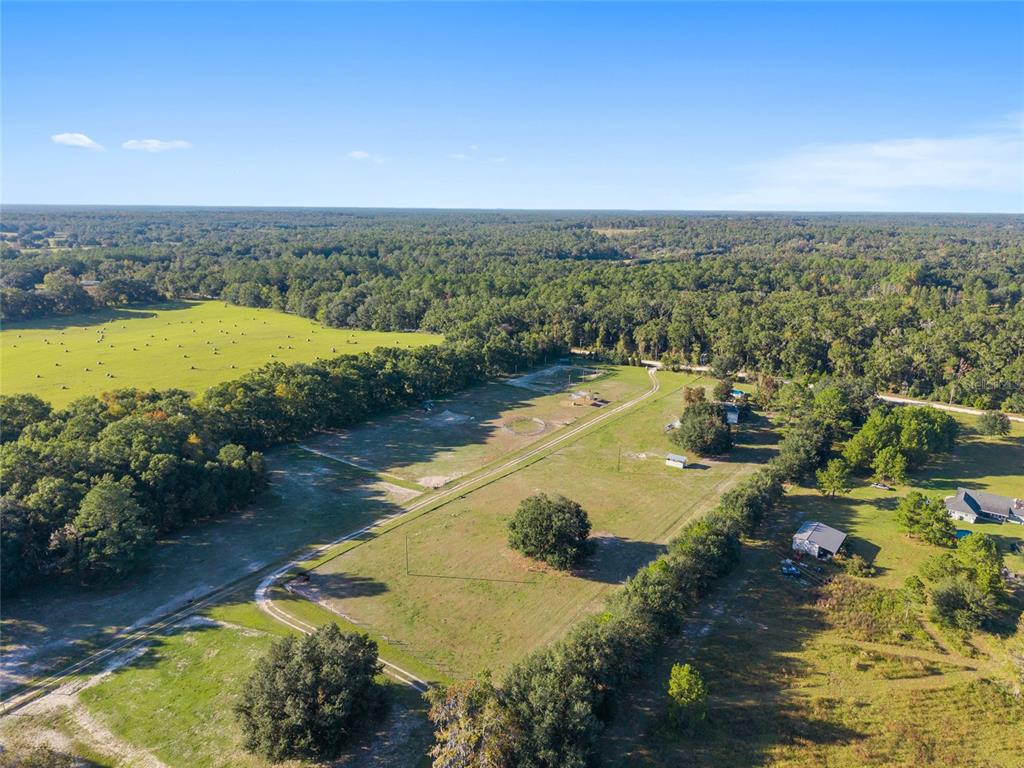 760 Southwest Barney Street High Springs, FL 32643 - Photo 57 of 57 an aerial view of residential houses with outdoor space