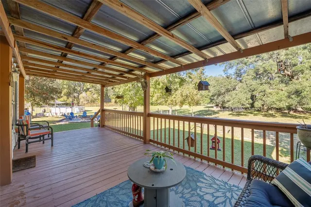 a balcony with wooden floor