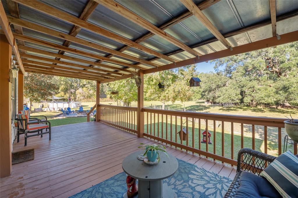 760 Southwest Barney Street High Springs, FL 32643 - Photo 8 of 57 a balcony with wooden floor