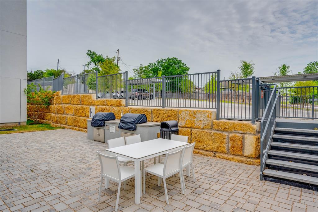 4801 Springdale Road, Unit 1307 Austin, TX 78723 - Photo 26 of 30 a outdoor space with patio lots of furniture and garden