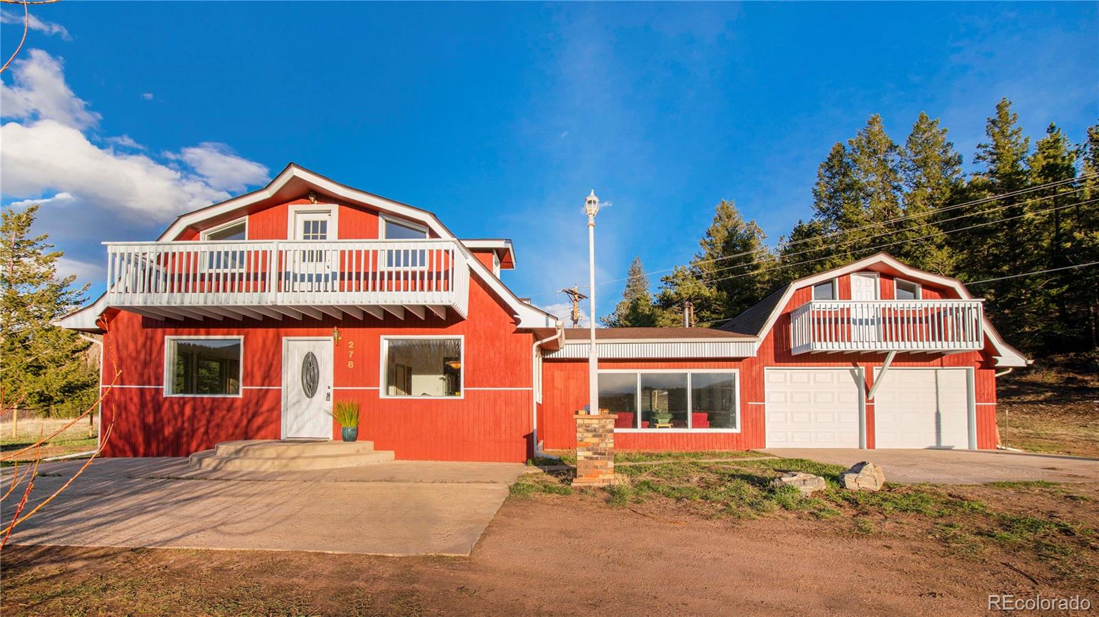 278 Jess-Mar Drive Shawnee, CO 80475 - Photo 1 of 40 a front view of a house with a yard