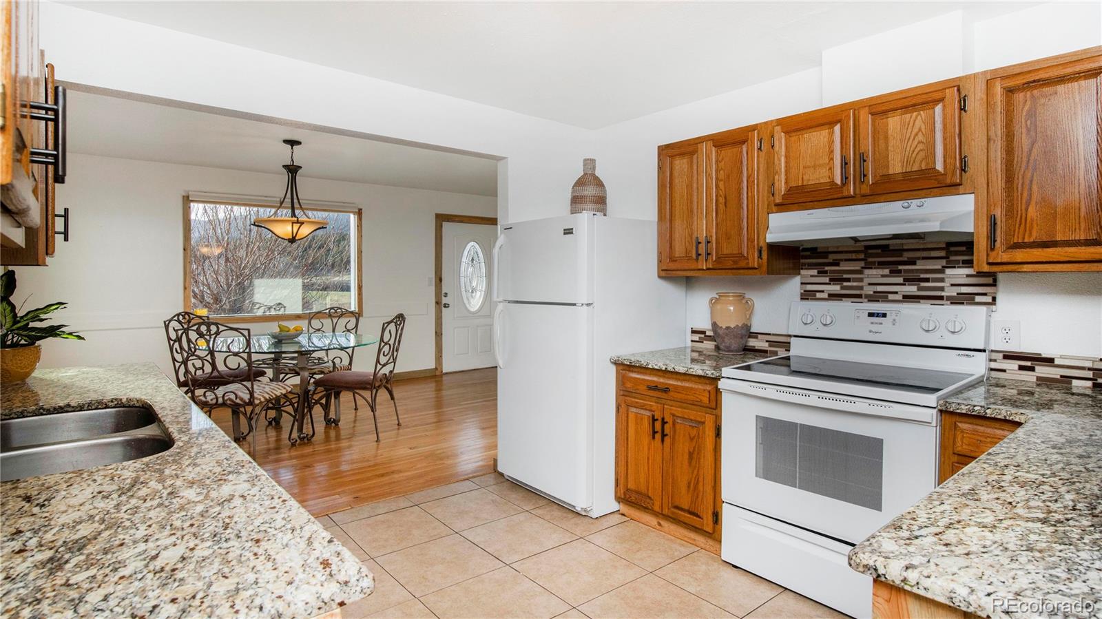 278 Jess-Mar Drive Shawnee, CO 80475 - Photo 15 of 40 a kitchen with stainless steel appliances granite countertop a stove a sink and a microwave