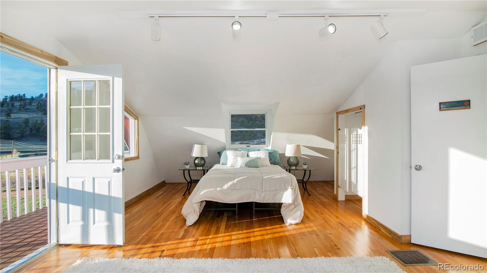 278 Jess-Mar Drive Shawnee, CO 80475 - Photo 29 of 40 a living room with wooden floor furniture and a window