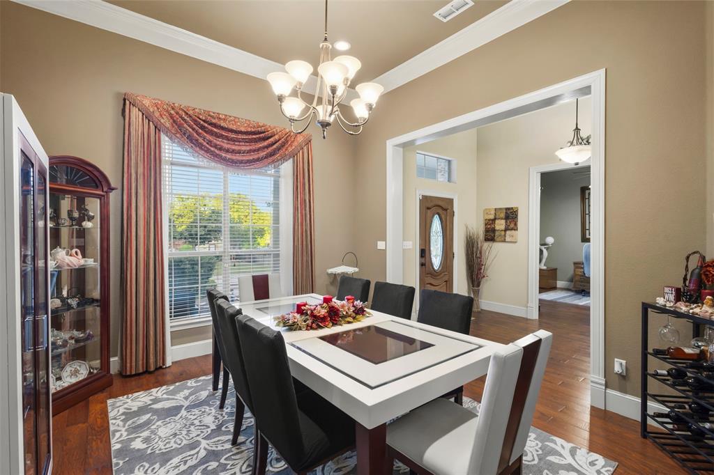 105 Country Ridge Court Red Oak, TX 75154 - Photo 9 of 40 a view of a dining room with furniture window and wooden floor
