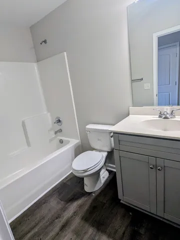 a bathroom with a sink toilet and bathtub