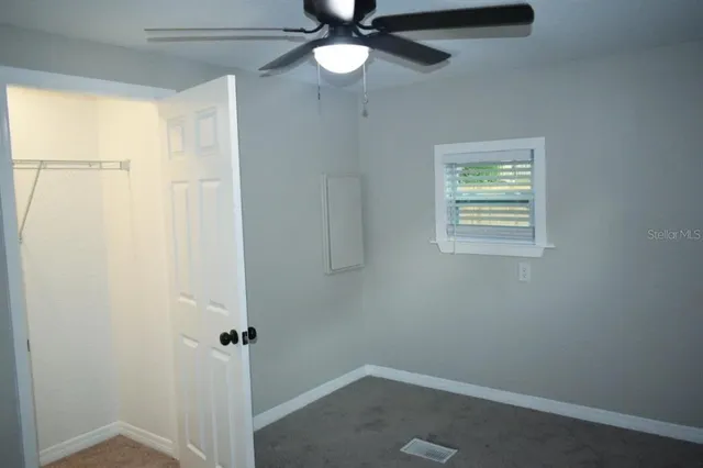 a view of an empty room with a window