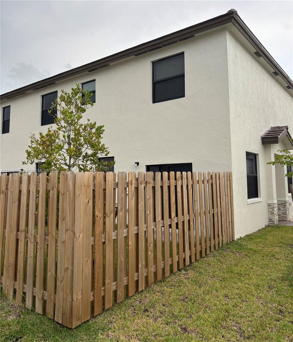 Goulds Miami, FL 33170 - Photo 3 of 8 a view of a house with wooden fence