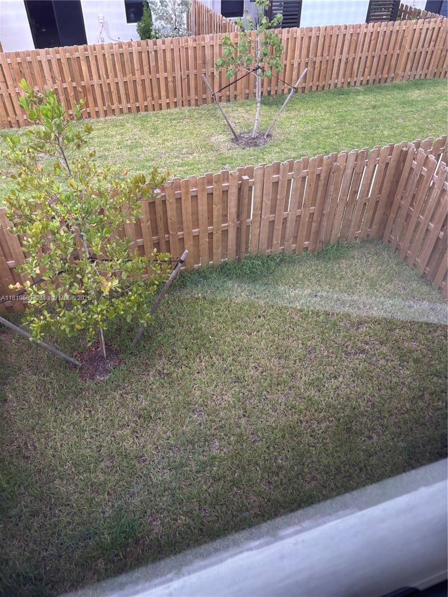 Goulds Miami, FL 33170 - Photo 7 of 8 a view of a backyard with a fence