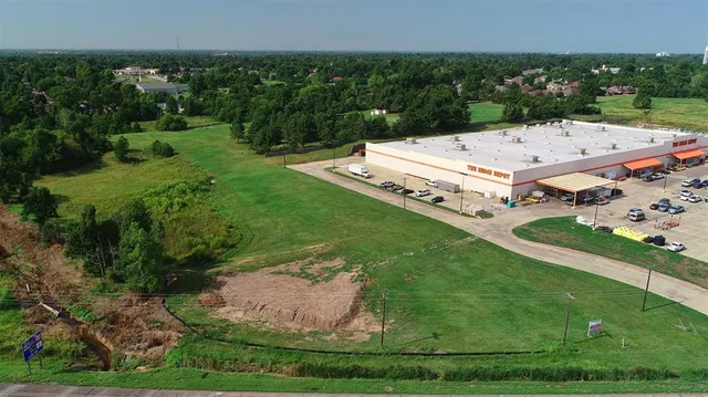 an aerial view of a house with outdoor space