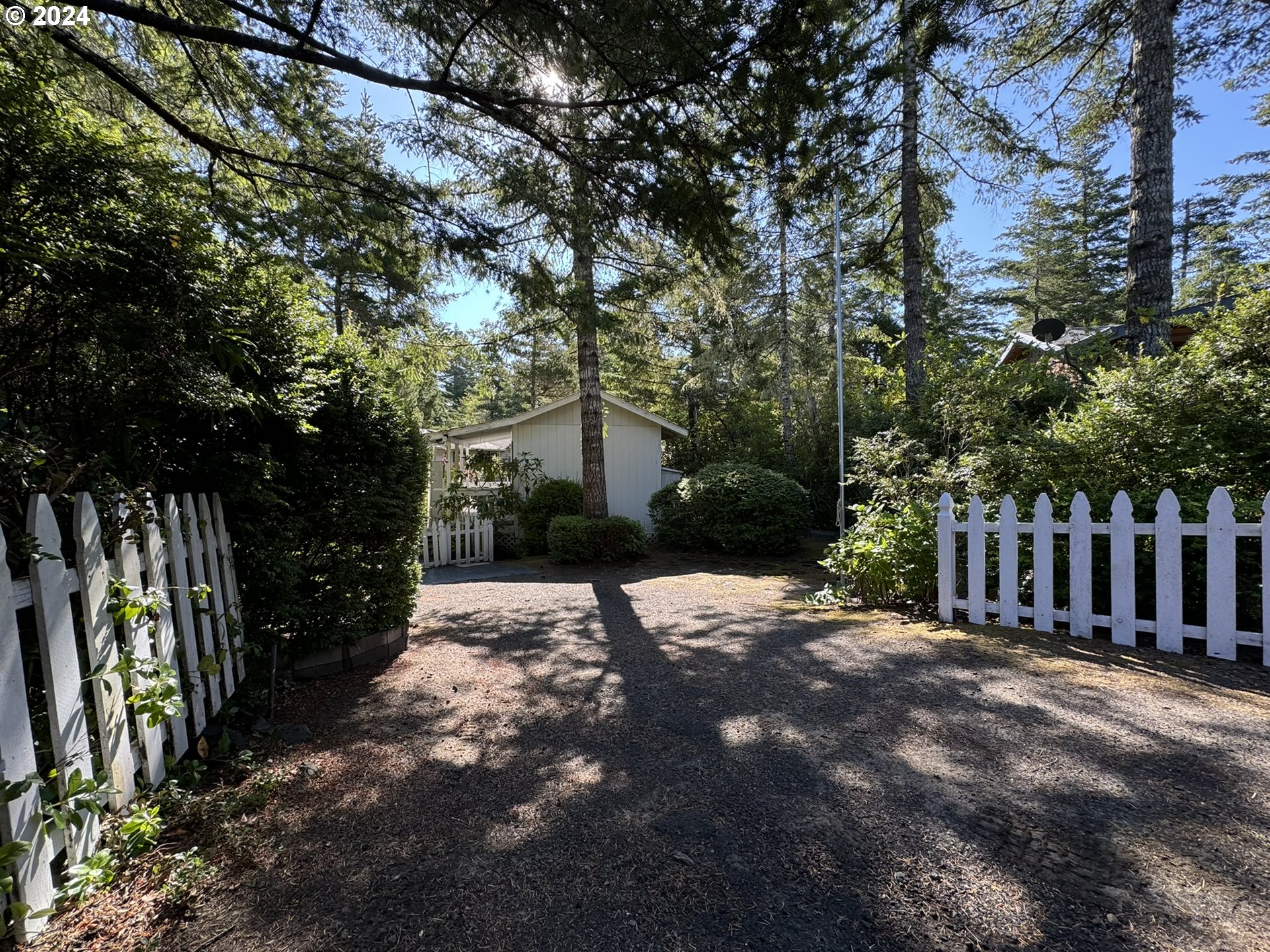246 Horseshoe Bend Florence, OR 97439 - Photo 2 of 33 a view of a park with a tree