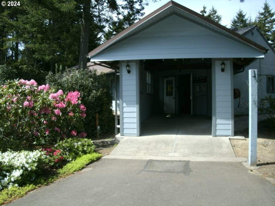 246 Horseshoe Bend Florence, OR 97439 - Photo 28 of 33 a view of a house with potted plants