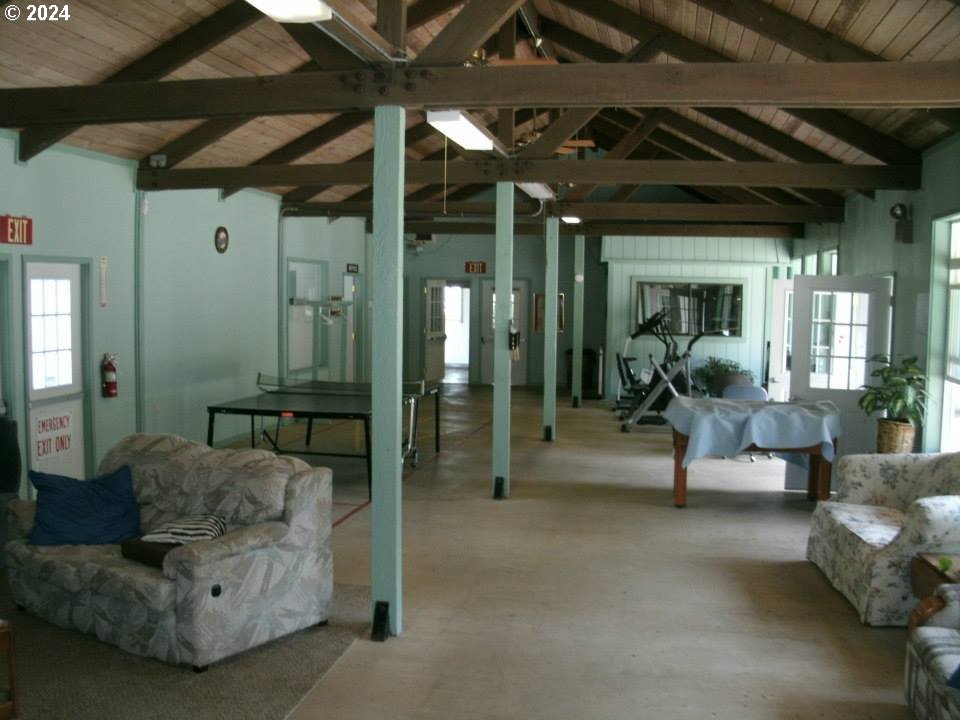 246 Horseshoe Bend Florence, OR 97439 - Photo 33 of 33 a living room with furniture and a chandelier