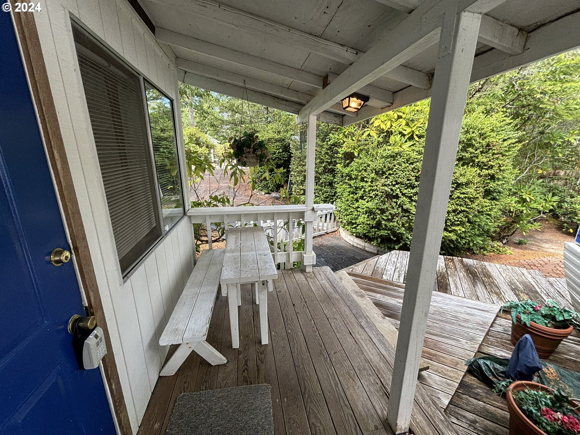 246 Horseshoe Bend Florence, OR 97439 - Photo 4 of 33 a view of balcony with furniture and garden
