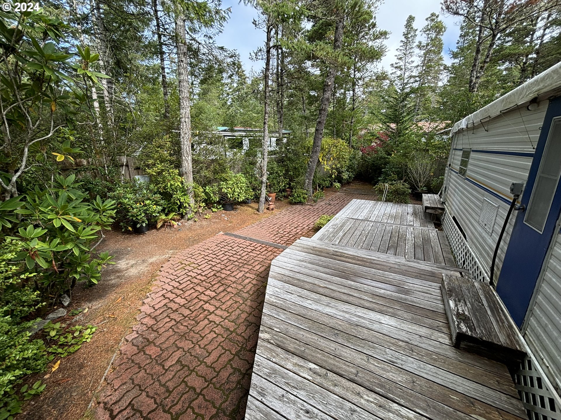 246 Horseshoe Bend Florence, OR 97439 - Photo 8 of 33 a view of a backyard with sitting area