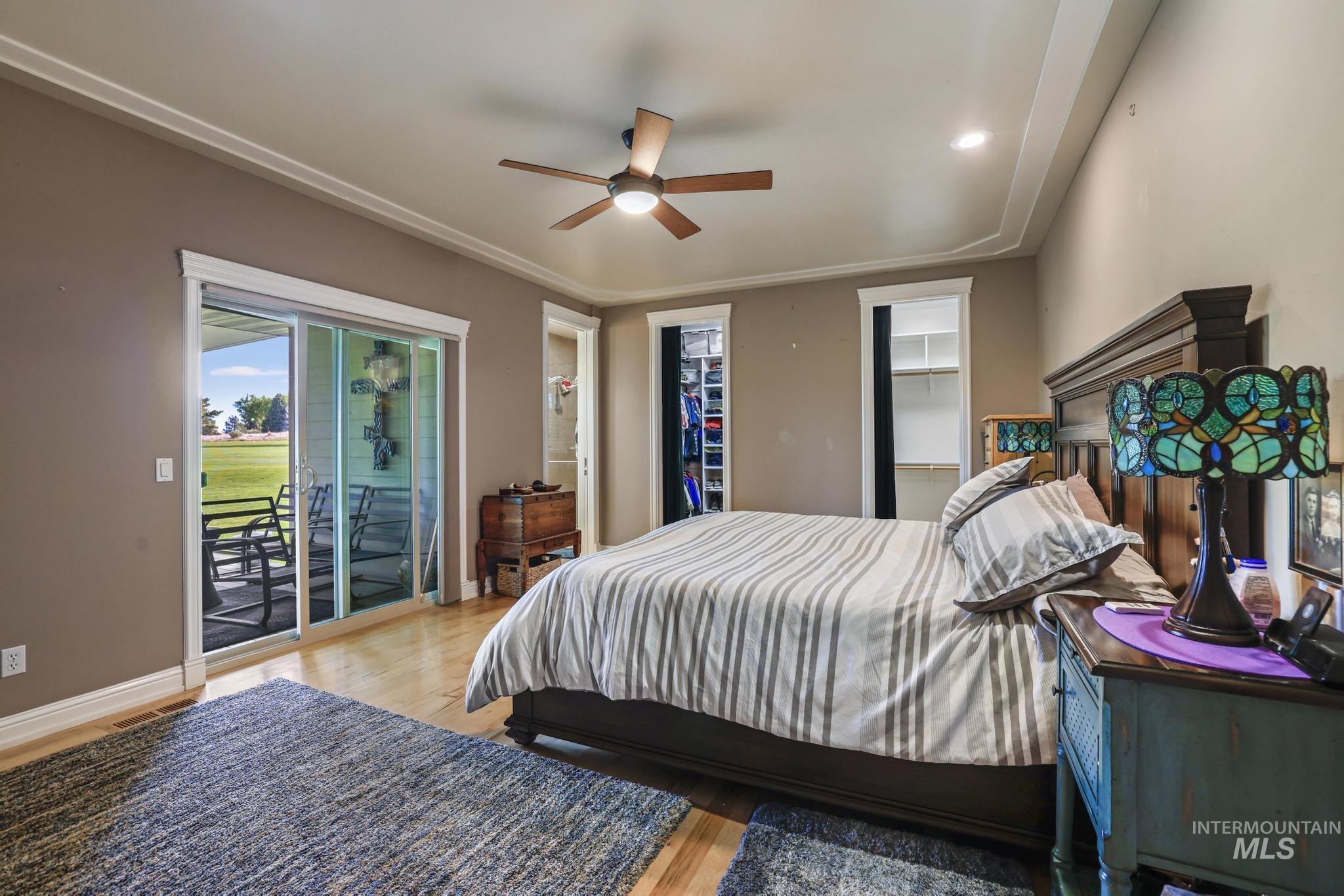 100 Olympic Road Jerome, ID 83338 - Photo 20 of 50 Sliding glass doors opening to an outdoor patio with open green space