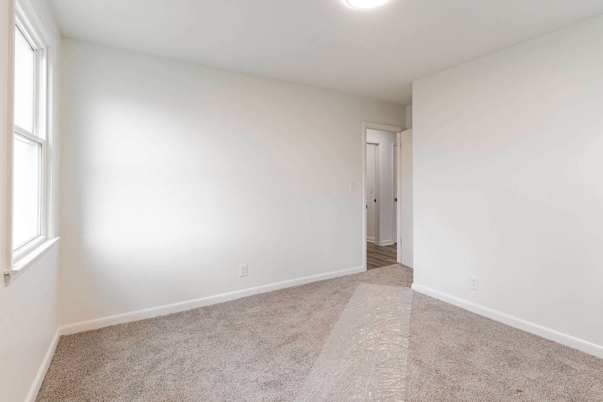 1307 Atlas Street Murfreesboro, TN 37130 - Photo 11 of 24 an empty room with an entryway and window